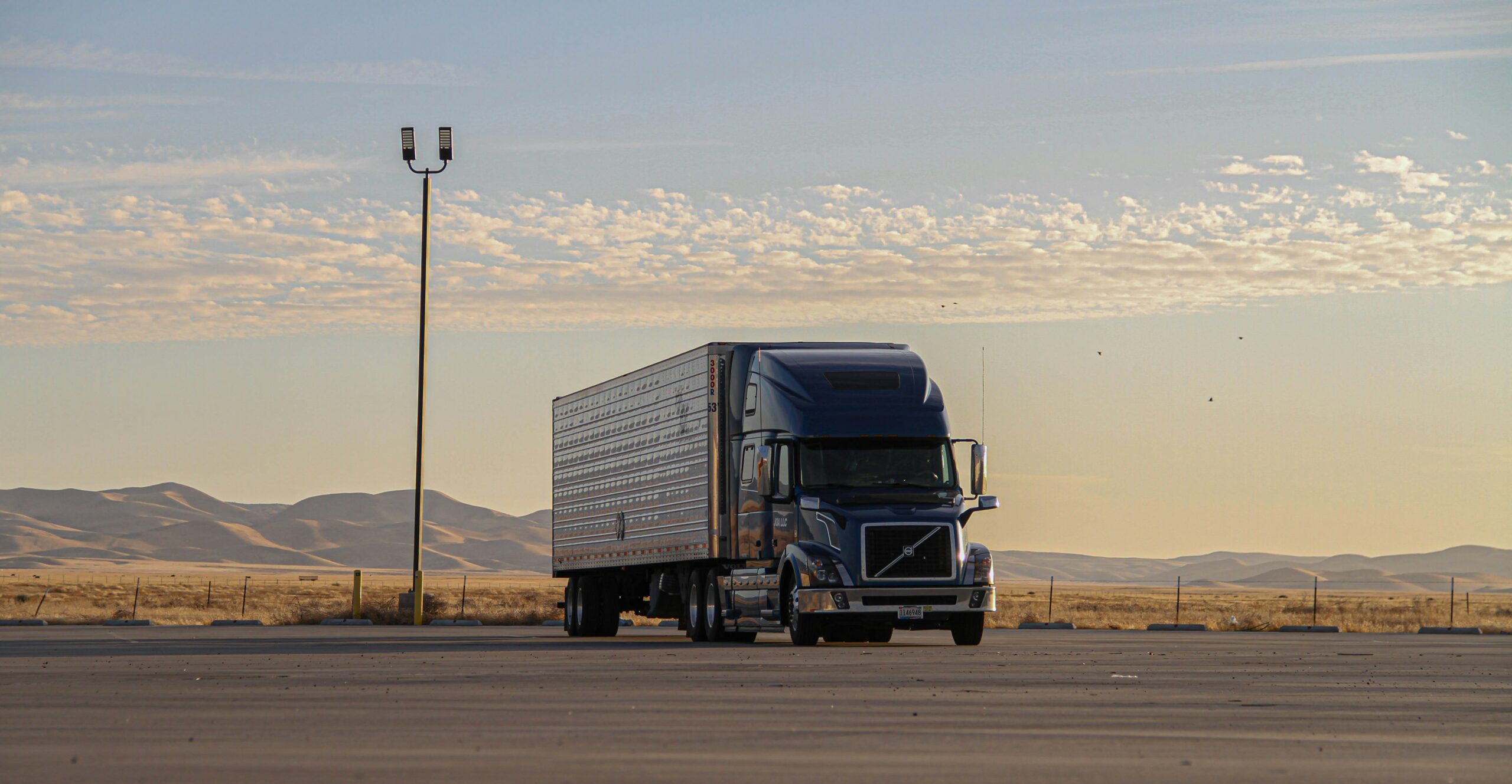 In Truck dispatching, a dispatcher analysing routes and schedules on a computer screen to avoid common truck dispatching mistakes